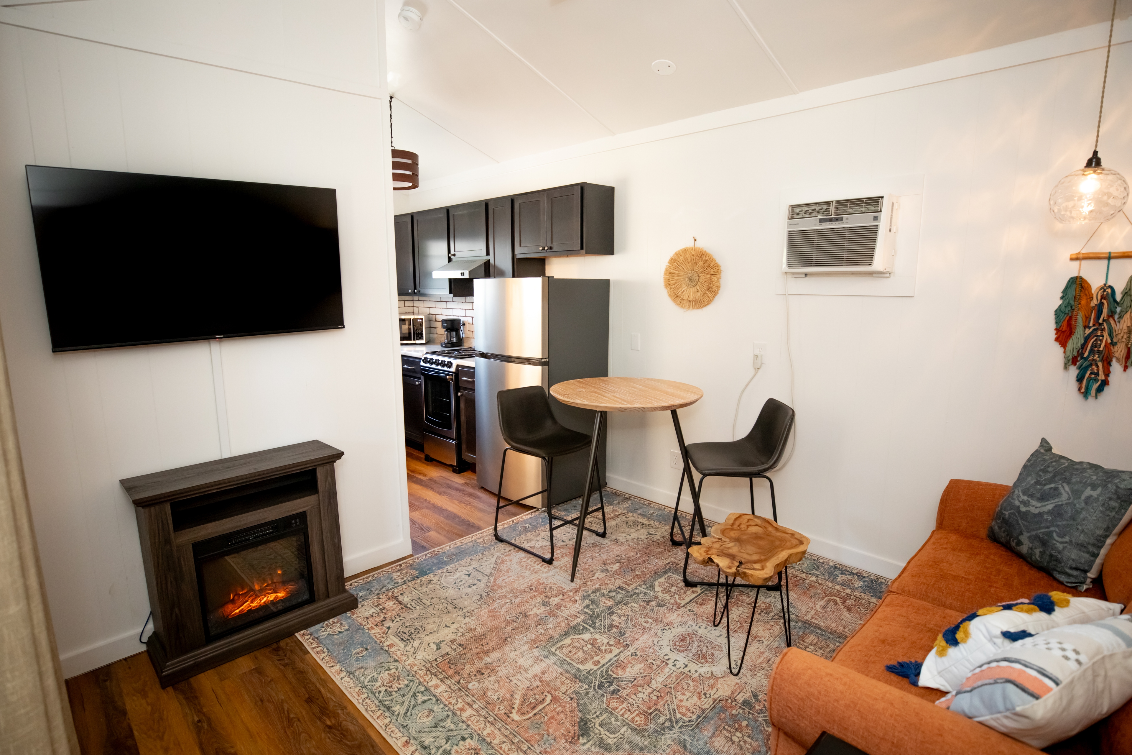 living room sofa with end table and coffee table and photo on wall