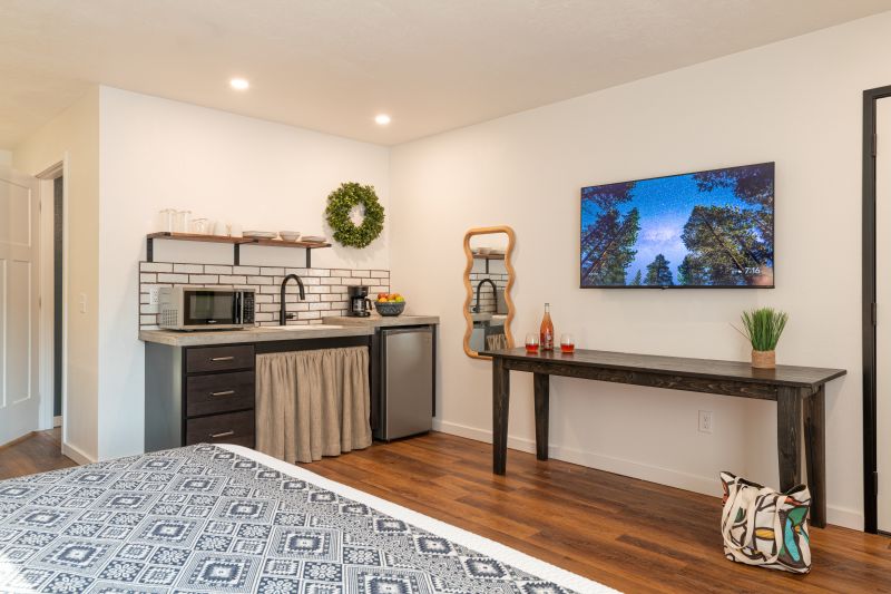 accessible kitchenette with tv and table underneath