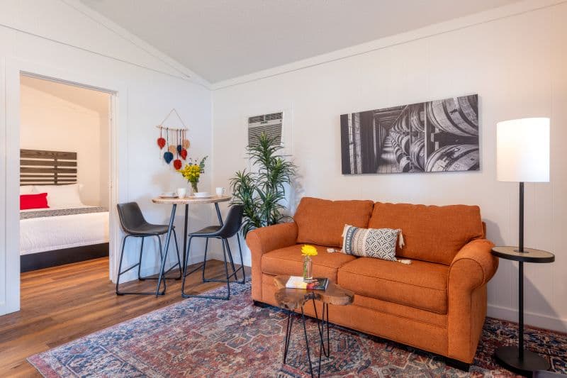 living room with couch, coffee table and dinette set