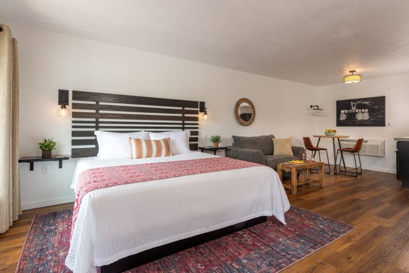 king bed in room with wood floor