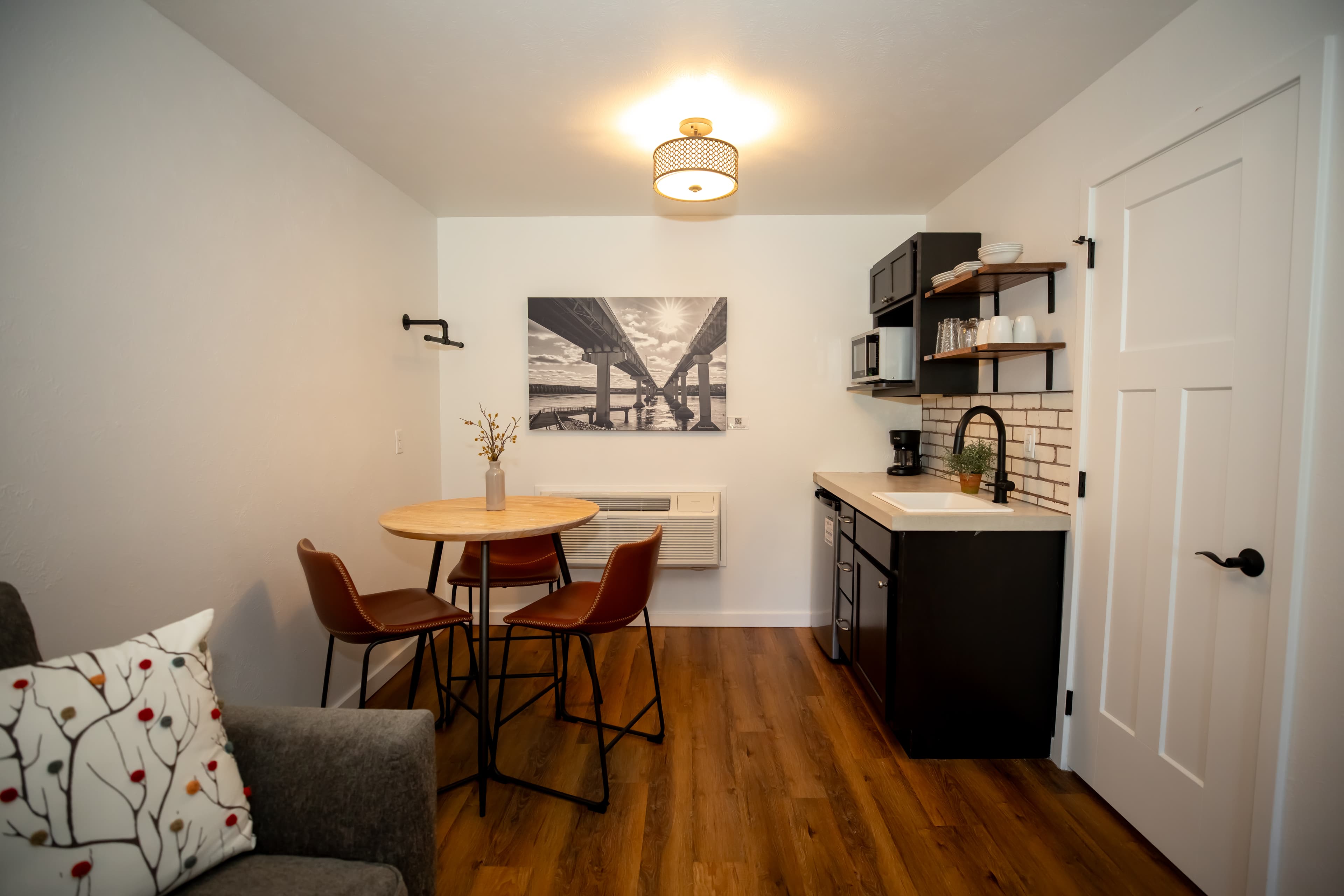 hotel room with seating and kitchenette