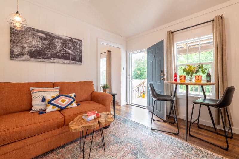 living room with a dinette set in front of a window