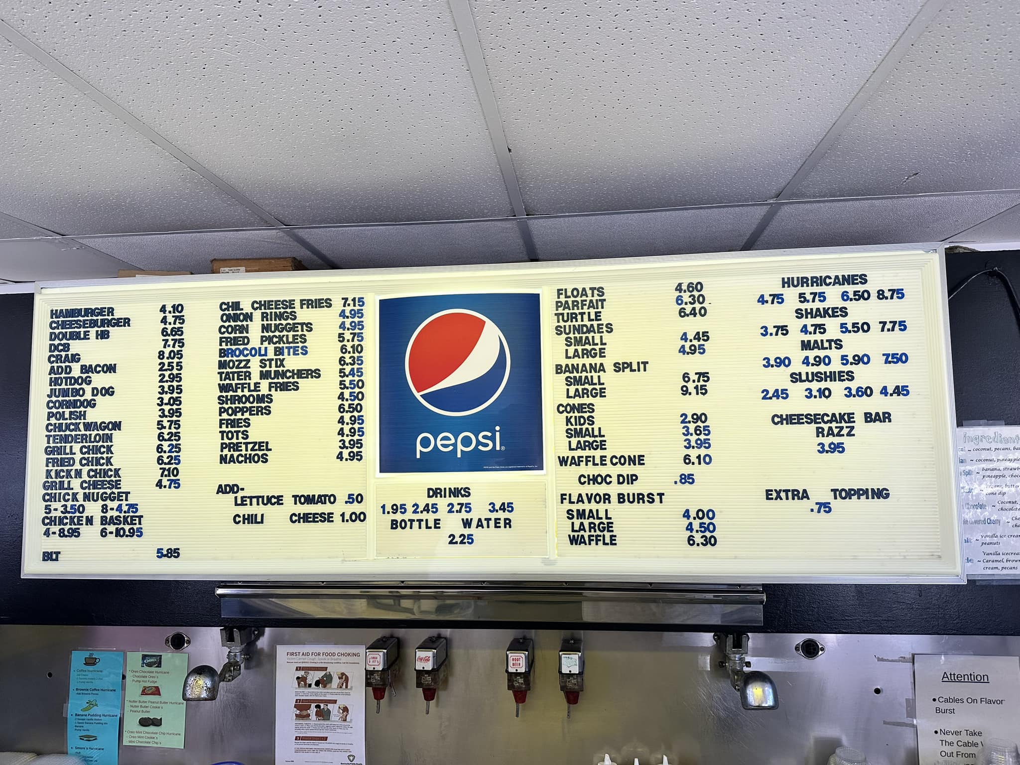A menu board displaying a variety of food and drink items with prices.