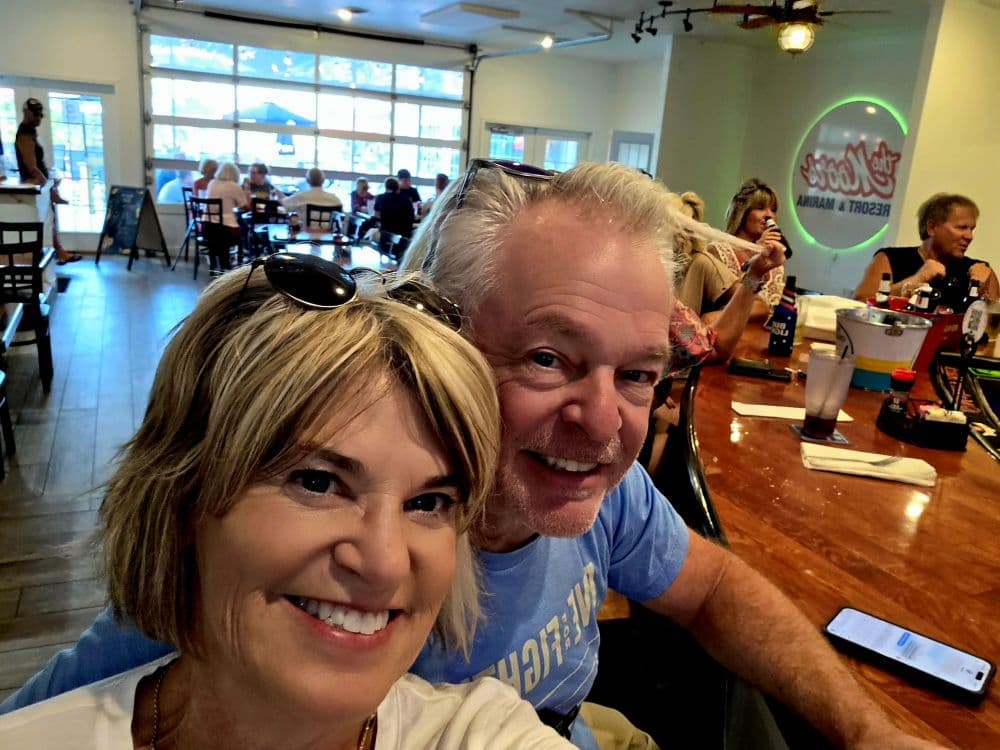 a selfie of a couple sitting at a bar at Ralph's Harborview Restaurant
