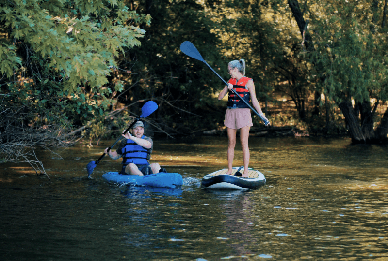 two people on paddleboards on a lake